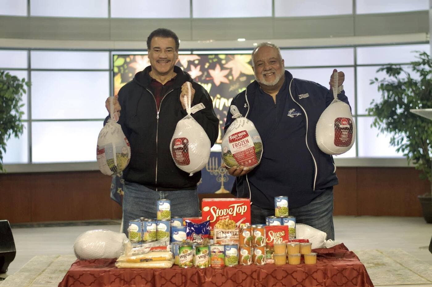 NGBM members with Thanksgiving turkeys and food donations for the community
